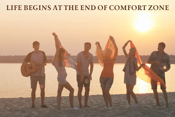 Comfort zone concept, Joyful friends having fun on shore at sunset outdoors