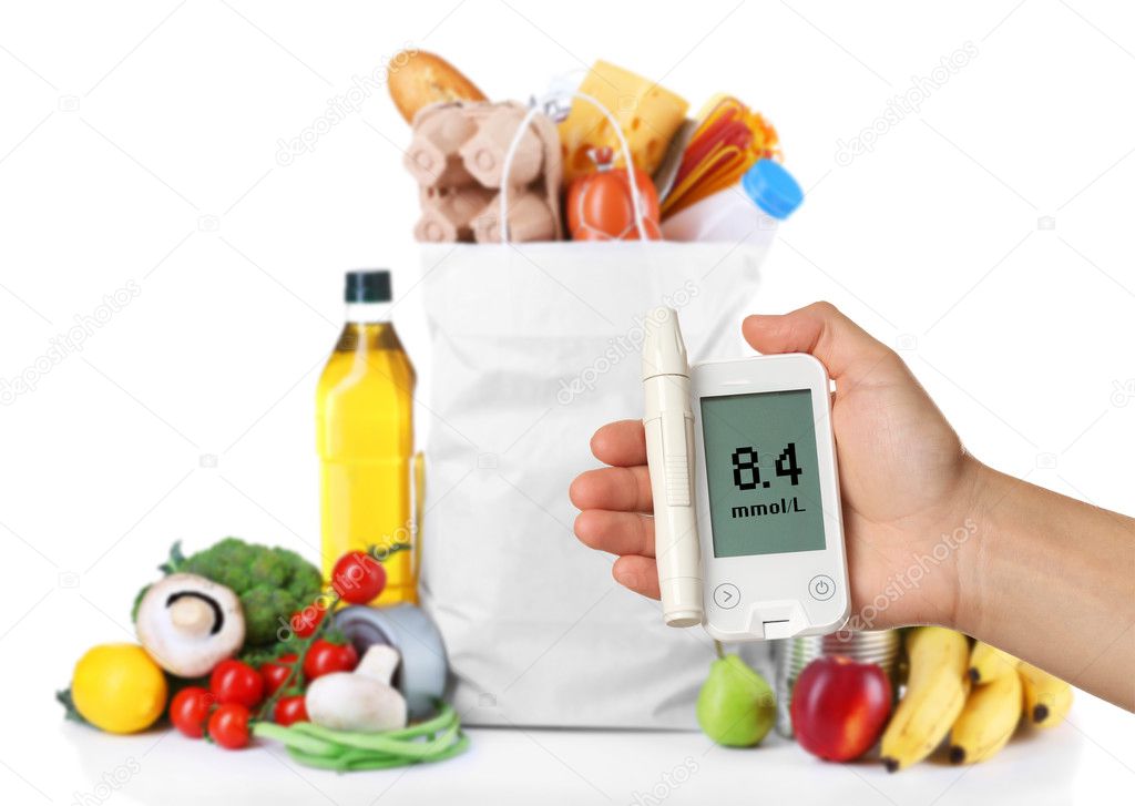 Male hand holding glucometer with bag of fresh products on white background. Diabetes concept