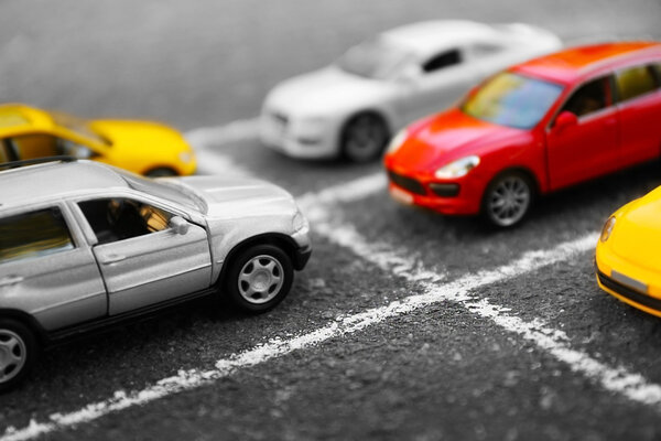 Close up of toy cars parking