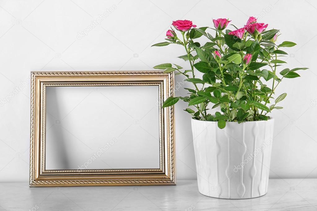 Vase With Roses And Photo Frame On Table Stock Belchonock Vase With Roses And Photo Frame On Table Stock