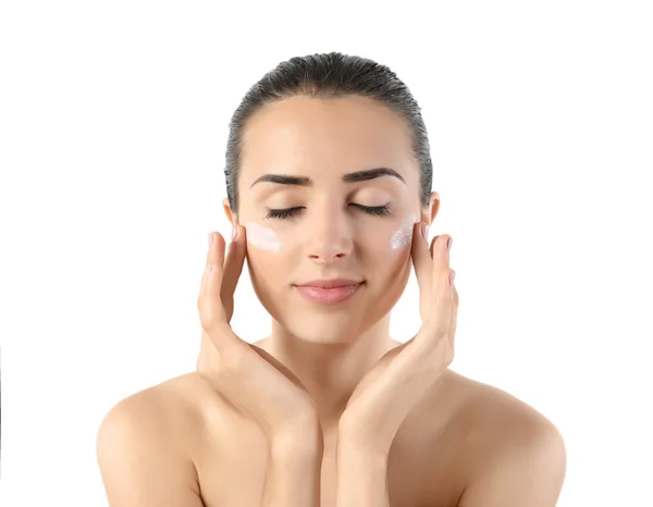 Woman applying facial cream — Stock Photo, Image