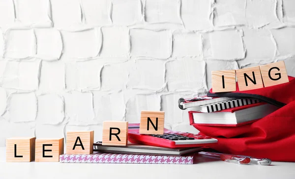 Cubes with word LEARNING on stationery set — Stock Photo, Image