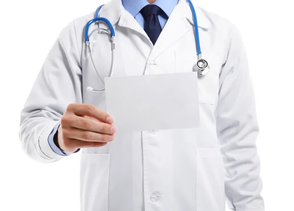 Male doctor holding paper on white background — Stock Photo, Image