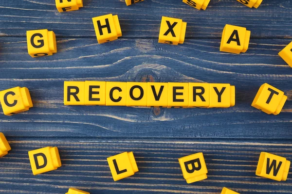 Word Recovery gemaakt van kubussen — Stockfoto