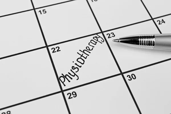Woord fysiotherapie op kalender planner — Stockfoto