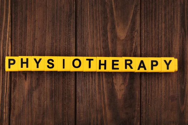 Word PHYSIOTHERAPY made of yellow cubes — Stock Photo, Image