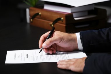 Man signing testament clipart