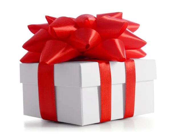 Gift box decorated with red ribbon — Stock Photo, Image