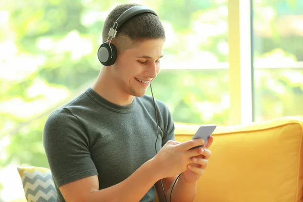 Young Man Listening Music Smartphone Room — Stock Photo, Image