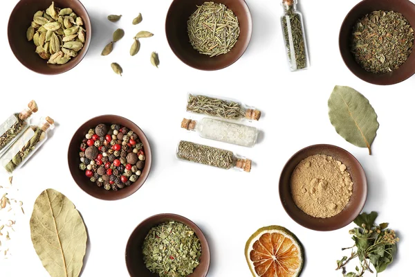 Flat lay of assorted herbs and spices on white background — Stock Photo, Image