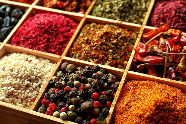 Different spices in wooden cells — Stock Photo, Image