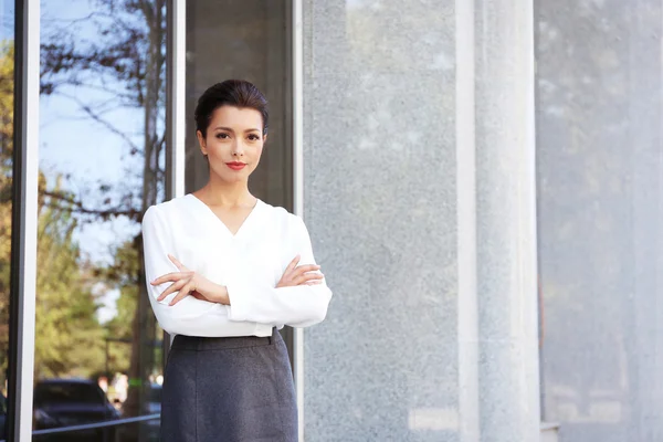 Beautiful businesswoman near office — Stock Photo, Image