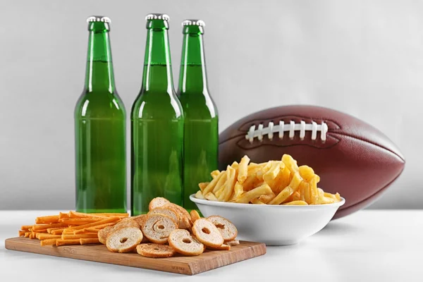 Ball, snacks and bottles of beer — Stock Photo, Image