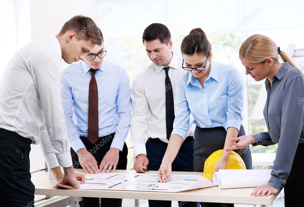 Group of creative engineers planning new project in office