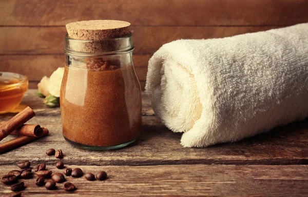 Body scrub and coffee on wooden table — Stock Photo, Image