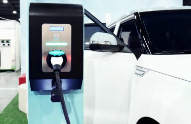 Electric car charger at the station clipart