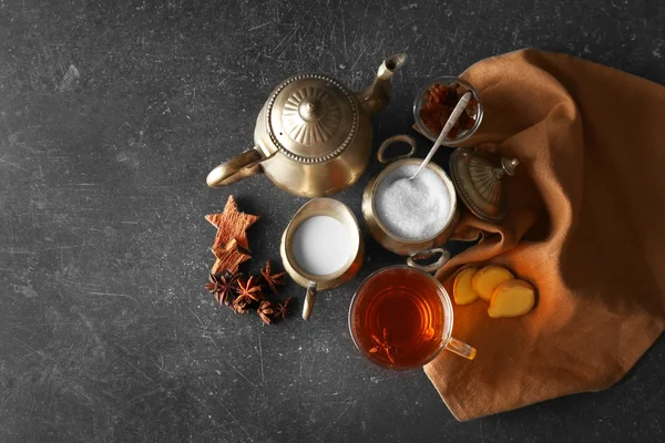 Ingredients for tea drinking on grey background, flat lay — Stock Photo, Image