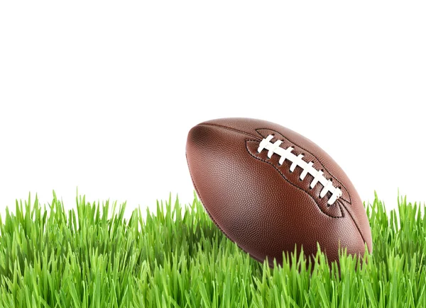 American football on green grass isolated on white — Stock Photo, Image