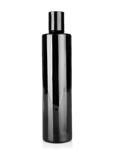 Чорна косметична пляшка ізольована на білому — стокове фото