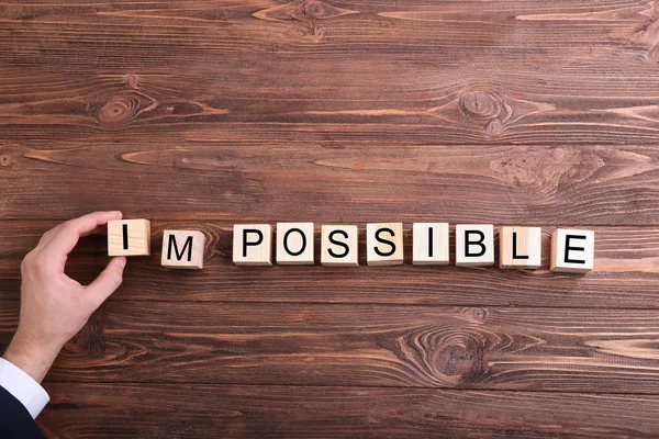 Human hand turning word impossible into possible — Stock Photo, Image