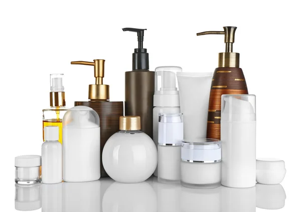 Diferentes botellas de cosméticos aislados en blanco — Foto de Stock