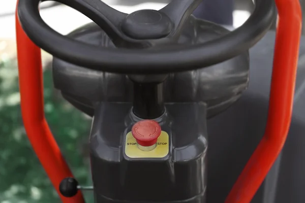 Stop button under steering wheel of road roller, closeup — Stock Photo, Image