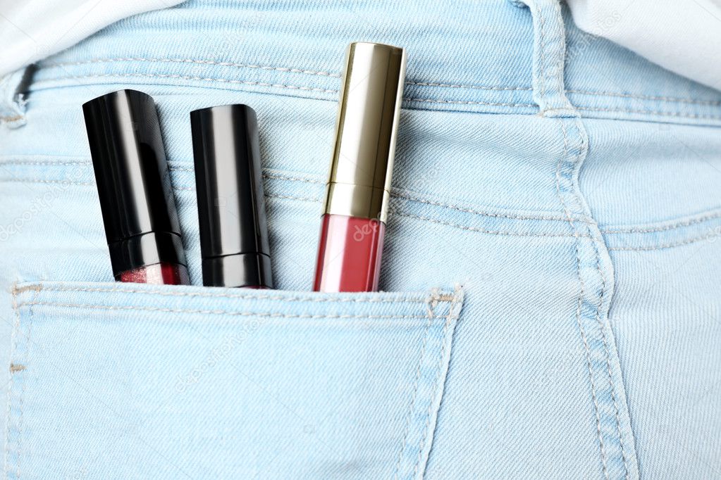 Lip gloss in jeans pocket, close up Stock Photo by ©belchonock 126326302