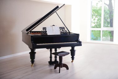 Piano in empty classic room clipart