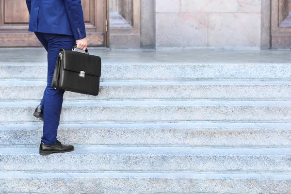 Lawyer with briefcase on stairs — Stock Photo, Image