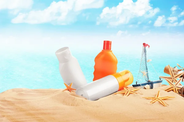 Accessories for tanning on beach on sea and sky background — Stock Photo, Image