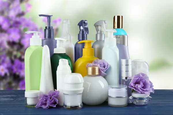 Set of body care products on lavender flowers background — Stock Photo, Image