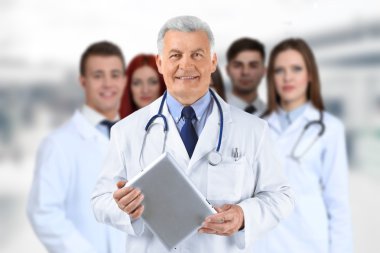 Doctor and medical team on blurred hospital background, Health care concept clipart