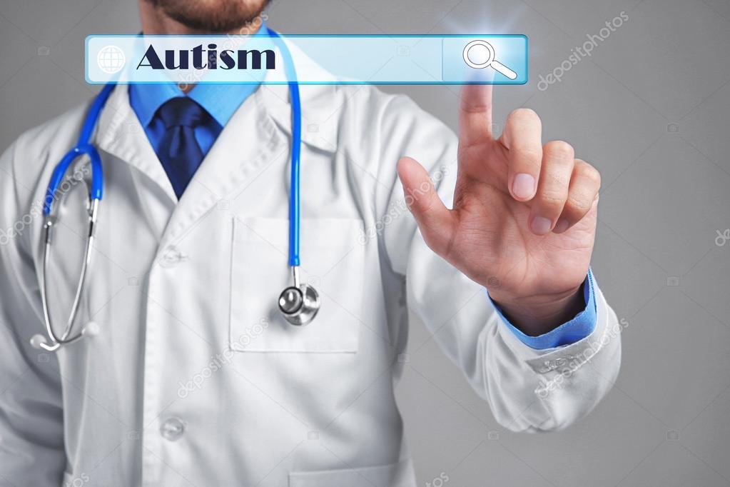 Doctor working with virtual screen. Children autism concept