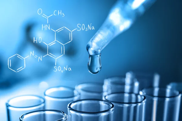 Pipette and test tube with liquid, closeup. Pharmaceutical research and health care concept. — ストック写真