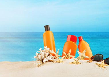Sun protection set on sea and sky background clipart