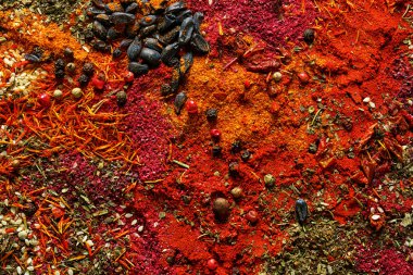 Mix of different flavored spices background clipart