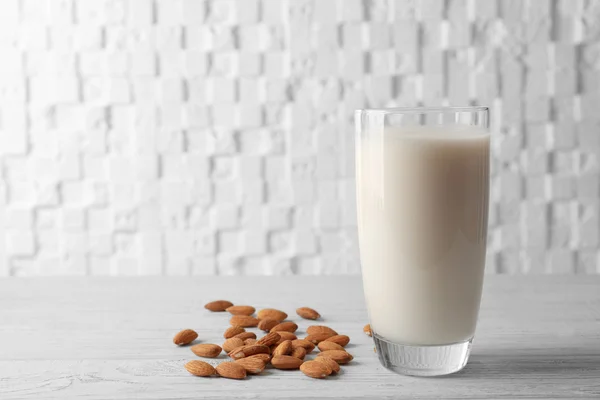 Milk on wooden table — Stock Photo, Image