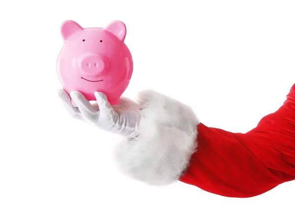 Santa Claus hand holding piggy bank on white background — Stock Photo, Image