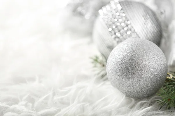 Close up view of beautiful Christmas bauble on white fur — Stock Photo, Image
