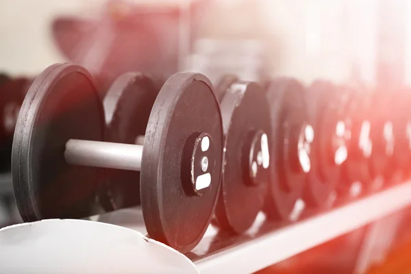 Lot of dumbbells in gym close-up — Stock Photo, Image
