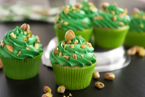 Pistachio cupcakes on table