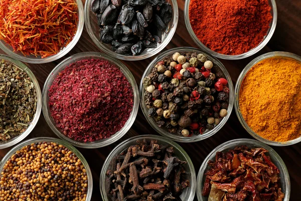 Various spices in glass bowls, close up — Stock Photo, Image