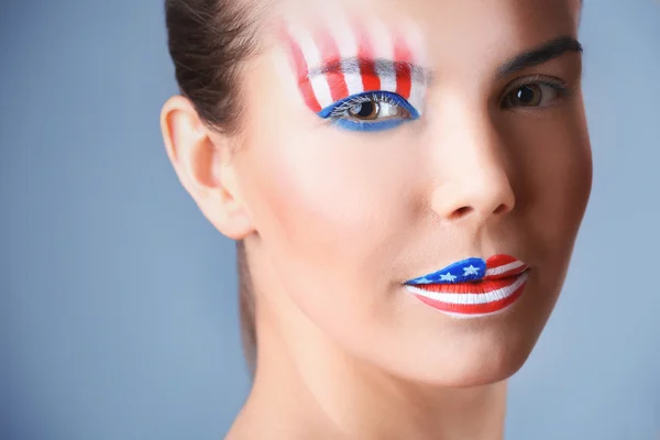 Girl with USA makeup on grey background — Stock Photo, Image
