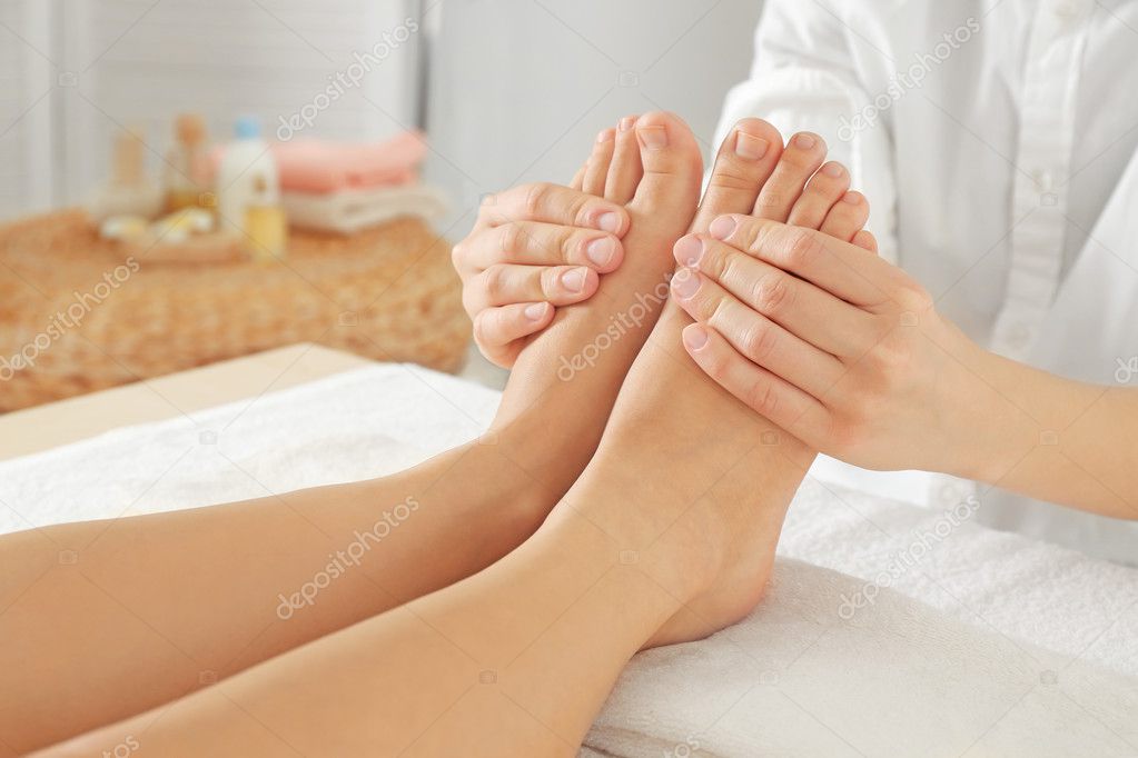 Foot massage in spa salon, closeup — Stock Photo © belchonock 127104056