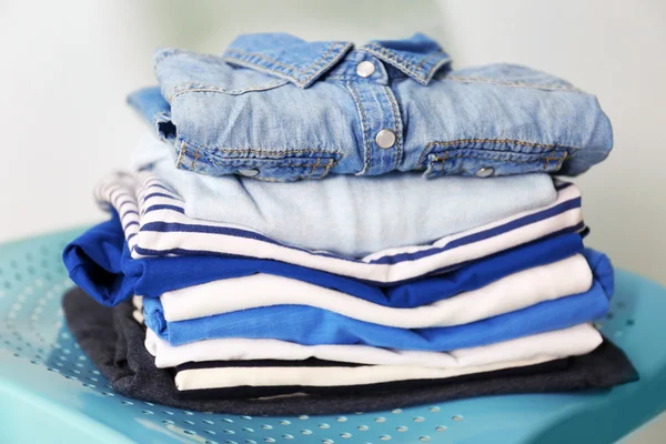 Pile of clothes on chair, closeup — Stock Photo, Image