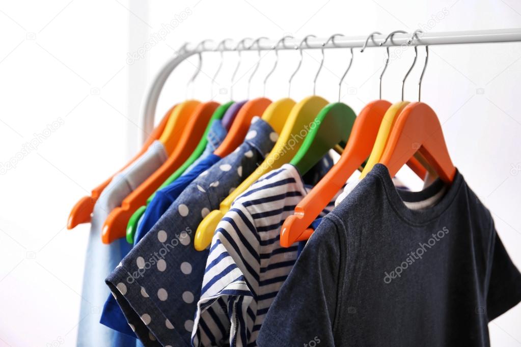 Clothes hanging on rack, closeup