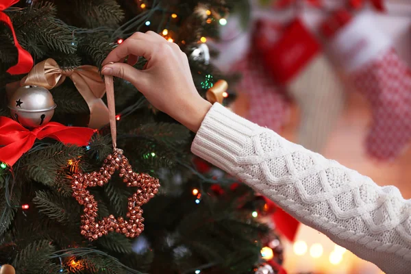 Female hand decorating Christmas tree, closeup — Stock Photo, Image