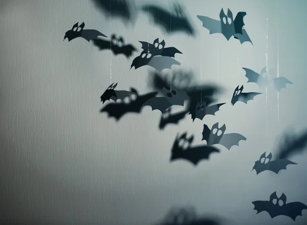 Paper bats on grey background as Halloween decor — Stock Photo, Image