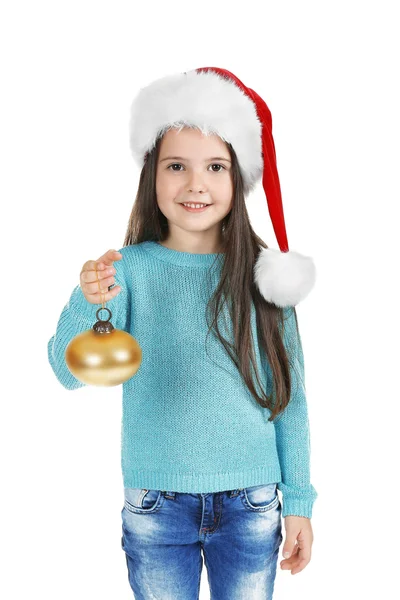 Cute little girl in Santa hat with Christmas ball on white background — Stock Photo, Image