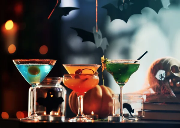 Close up view of colorful cocktails and decor for Halloween party, on blurred background — ストック写真